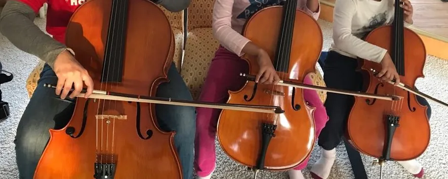 Family playing cellos
